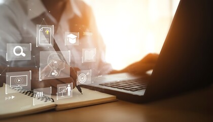 Business professional using laptop with digital interface and holographic icons overlay