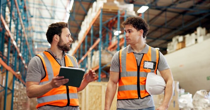 Warehouse, shipping and men on tablet for supply chain, delivery schedule and inventory checklist. Distribution, teamwork and workers on digital tech for online logistics, meeting and inspection