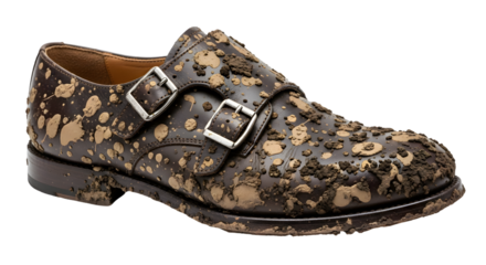 Distressed brown leather monk strap shoe covered in mud splatters, a perfect blend of rugged style and luxury, ideal for adventurous fashion statements and unique marketing campaigns