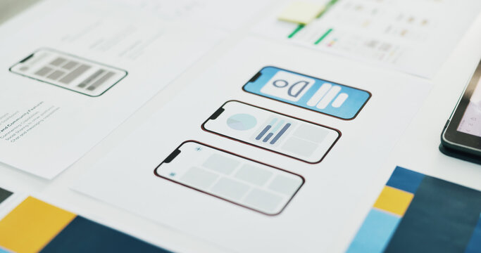 Ux, wireframe and mobile app on paperwork, office and design for digital product development or web. Business, UI template and documents with info for software updates, flowchart and phone prototype