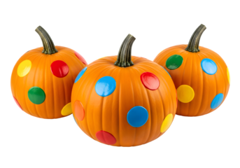 Festive Halloween pumpkins decorated with colorful polka dots offer a cheerful and whimsical touch to autumn celebrations, creating a playful and inviting seasonal atmosphere