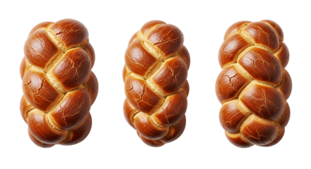 Three braided challah breads lined up against a black background in a studio setting close up view