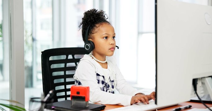 Typing, computer or child with headset in office, business professional cosplay or customer care career. Pc, tech support dressup or girl with virtual assistant costume, hotline agent and call center