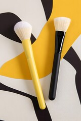 Makeup brushes on abstract background, beauty tools for applying cosmetics and enhancing face