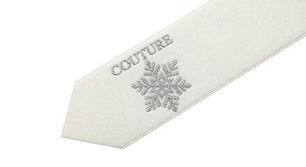 Closeup of a white tie with a snowflake and the word couture isolated on transparent background