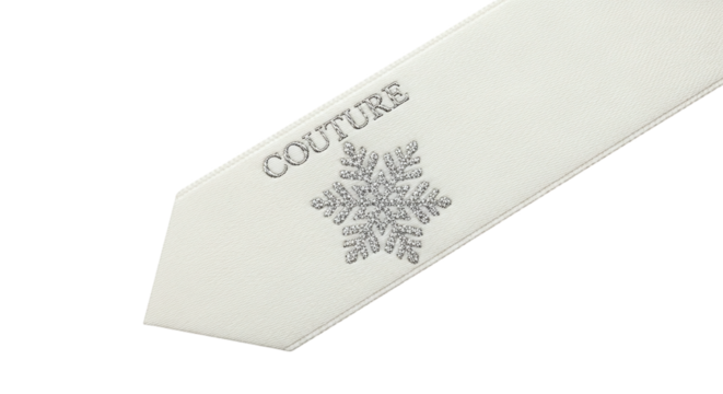 Closeup of a white tie with a snowflake and the word couture isolated on transparent background