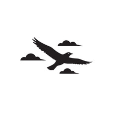 Silhouette of a bird in flight with long wings, minimal clouds behind.