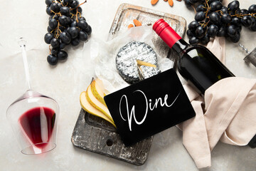 Bottle and glasses of red wine with snacks. Party concept.