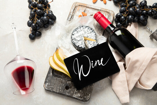 Bottle and glasses of red wine with snacks. Party concept.