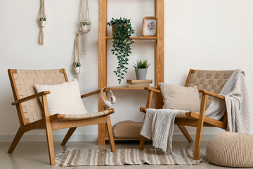 Interior of living room with wooden armchairs and shelf unit