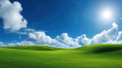 Obraz premium Vibrant Green Hills Under Bright Blue Sky with Fluffy Clouds and Radiant Sunlight, Perfect for Nature and Landscape Photography Needs