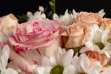 mix flowers of different colors, a flower arrangement for giving from different colors and different types of flowers