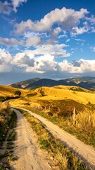A scenic view of rolling hills under a bright sky with scattered clouds, a dirt road leads through the terrain