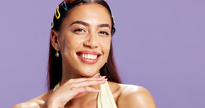 Portrait, confident and woman with makeup in studio for beauty, natural shine and makeover. Mockup space, gen z and person with smile for cosmetology, facial glow and aesthetic on purple background