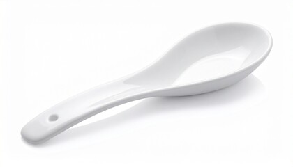 White ceramic soup spoon with broad bowl and short handle on neutral background for editorial culinary photography traditional utensil decor and poetic nourishment-themed visuals