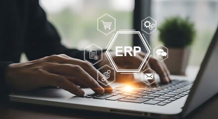 Business person using a laptop with erp system icons and network connections, representing enterprise resource planning and digital transformation