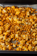 roasted hot cauliflower and chickpeas in tray close up