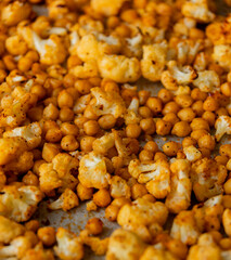 roasted hot cauliflower and chickpeas in tray close up