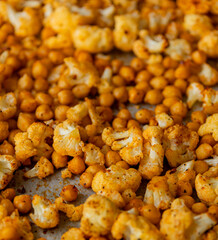 roasted hot cauliflower and chickpeas in tray close up