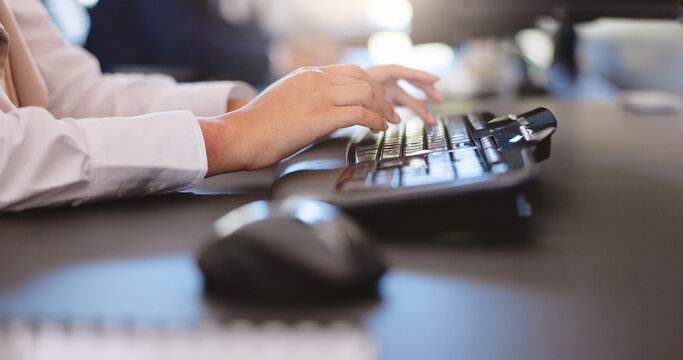 Hands, keyboard and typing with business person at desk in office for online report or review. Administration, computer and research with employee woman in professional workplace for feedback