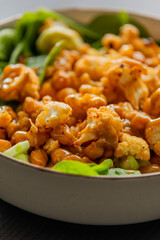 healthy fall salad with roasted cauliflower and chickpeas close up