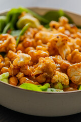 healthy fall salad with roasted cauliflower and chickpeas close up