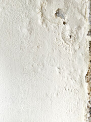 Damped, musty old painted wall. Textured exterior toilet wall in room at dhamma retreat center, Saraburi, Thailand. 25 OCT 2025. A.M.