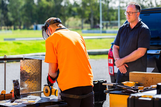 trade apprentice student using angle grinder during hands on tool demonstration class