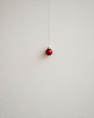 Red ornament hanging from string