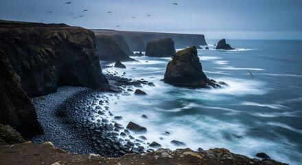 A scenic view of a rocky coastline with cliffs, ocean waves, and birds flying in the cloudy sky ai generated
