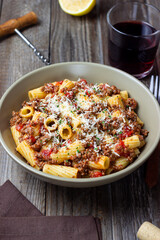 Pasta with bolognese sauce and cheese. Italian cuisine. Traditional recipe.