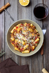 Pasta with bolognese sauce and cheese. Italian cuisine. Traditional recipe.