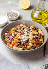 Pasta with bolognese sauce and cheese. Italian cuisine. Traditional recipe.
