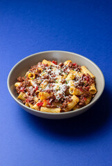 Pasta with bolognese sauce and cheese. Italian cuisine. Traditional recipe.