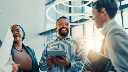 Speaker, meeting and tablet with business man in lobby for conference, planning and workshop. Seminar, expo project and feedback with people in convention center for collaboration and low angle