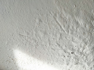 Damped, musty old painted wall. Closeup textured exterior toilet wall in room at dhamma retreat center, Saraburi, Thailand. 25 OCT 2025. A.M.