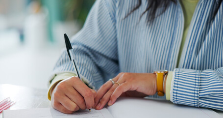 Education, hands and student writing notes with pen in book, learning knowledge or exam preparation. Studying, course revision and woman prepare for university test, academic info or subject summary