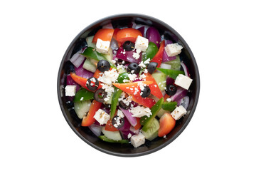A vibrant bowl of fresh Greek salad. This colorful dish is a feast for the eyes and the stomach, featuring a mix of fresh ingredients