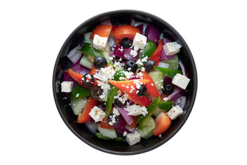 A vibrant and appetizing greek salad in a dark bowl, filled with fresh vegetables and feta cheese