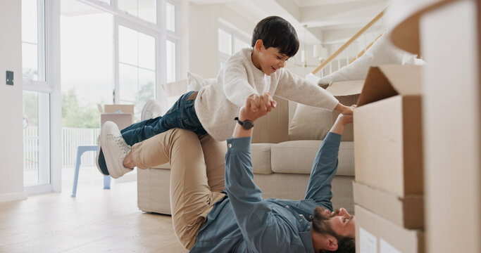 Moving, son and father playing airplane in new home, real estate and happy bonding in family house. Lounge, property investment and man lifting child in air, flying game and connection for support