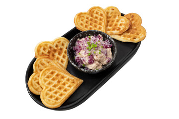 Delicious heart-shaped waffles and salad, beautifully arranged on a serving tray. Perfect for...