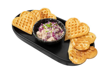 Heart-shaped waffles and a delicious salad in a decorative plate, A delightful dish prepared for a special occasion.