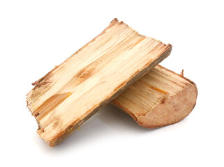A fresh cut pile of wooden logs neatly stacked 