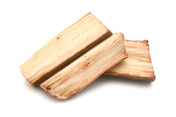 A fresh cut pile of wooden logs neatly stacked 