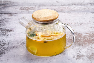 Teapot with orange and mint tea