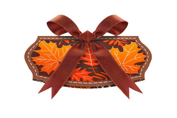 autumn gift box with maple leaves and red bow, thanksgiving present fall season concept