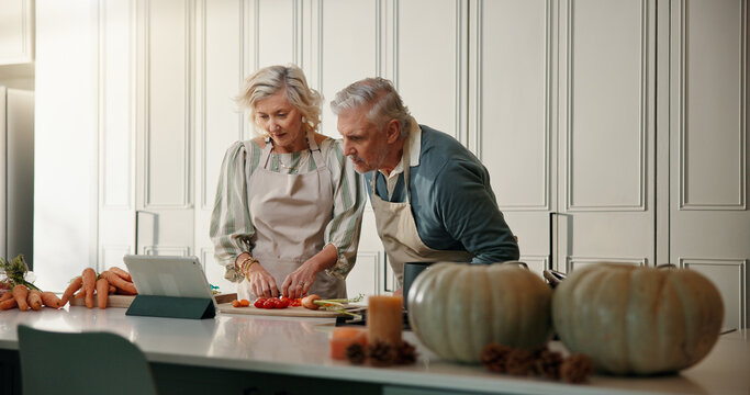 Old couple, cooking or check tablet in kitchen, ingredient preparation or watch video for food tutorial. Online recipe, blog post or senior woman with man reading with tech, steps or meal instruction