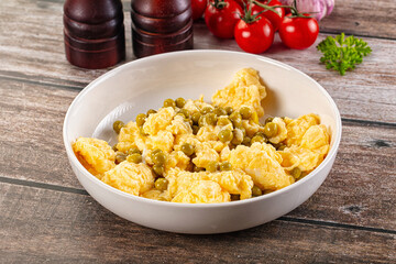 Scrambled egg omelet with green peas