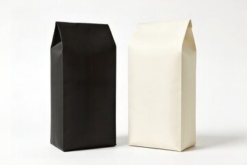 Two blank, tall product packaging bags, one black and one white, standing on an isolated studio background.