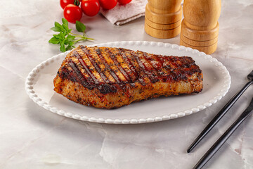 Grilled pork steak with bone